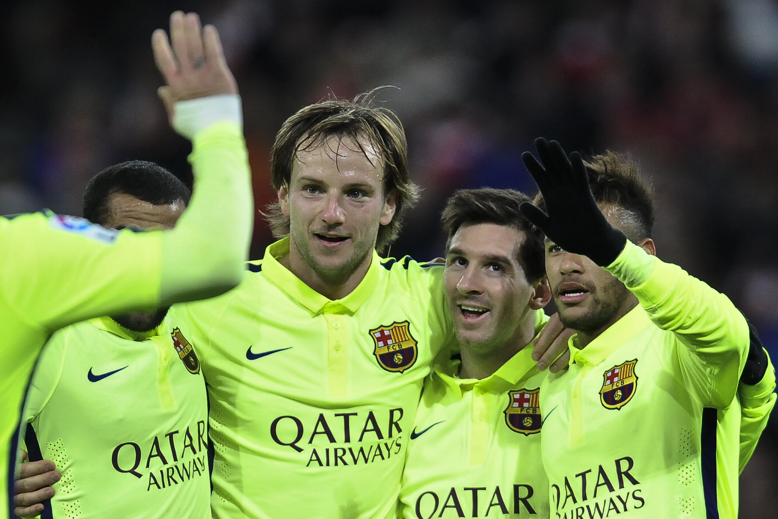 FC Barcelona's Lionel Messi of Argentina, second right, celebrates scoring his second and the fifth goal  of the match against Athletic Bilbao with teammates during their La Liga soccer match, at San Mames stadium in Bilbao, northern Spain, Sunday, Feb. 8, 2015. (AP Photo/Alvaro Barrientos)