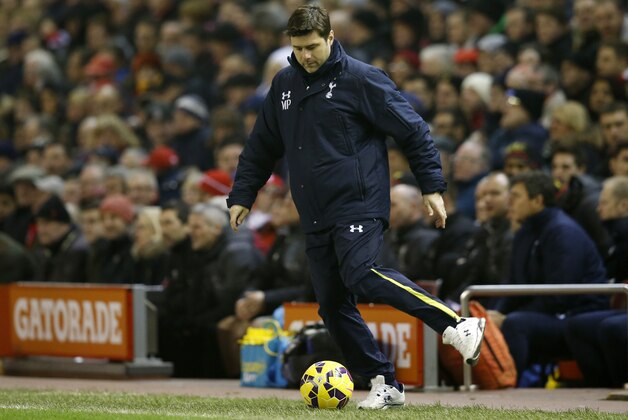 Tottenham manager Mauricio Pochettino kicks the ball during the English Premier League soccer match between Liverpool and Tottenham Hotspur at Anfield Stadium, Liverpool, England, Tuesday Feb. 10, 2015. (AP Photo/Jon Super)