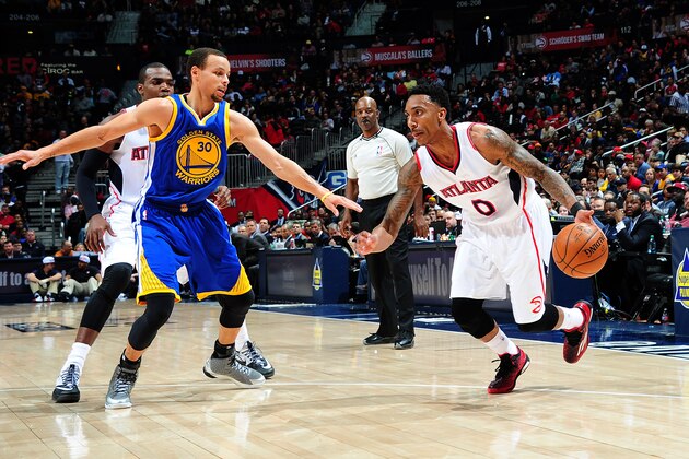 ATLANTA, GA - FEBRUARY 6: Jeff Teague #0 of the Atlanta Hawks drives against Stephen Curry #30 of the Golden State Warriors on February 6, 2015 at Philips Arena in Atlanta, Georgia.  NOTE TO USER: User expressly acknowledges and agrees that, by downloading and/or using this Photograph, user is consenting to the terms and conditions of the Getty Images License Agreement. Mandatory Copyright Notice: Copyright 2015 NBAE (Photo by Scott Cunningham/NBAE via Getty Images)