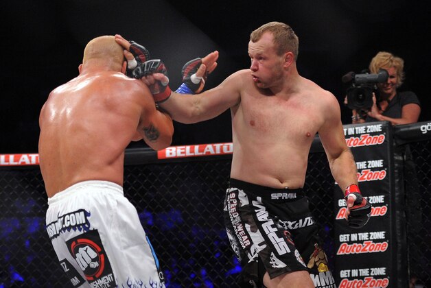 May 17, 2014; Southaven, MS, USA; Alexander Shlemnko (red gloves) fights against  Tito Ortiz (blue gloves) during BFC 120 at Landers Center. Mandatory Credit: Justin Ford-USA TODAY Sports