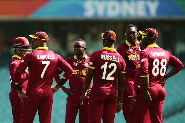 SYDNEY, AUSTRALIA - FEBRUARY 12:  West Indies players gather after Nikita Miller of West Indies took the wicket of Kyle Coetzer of Scotland during the ICC Cricket World Cup warm up match between the West Indies and Scotland at Sydney Cricket Ground on February 12, 2015 in Sydney, Australia.  (Photo by Matt King/Getty Images)