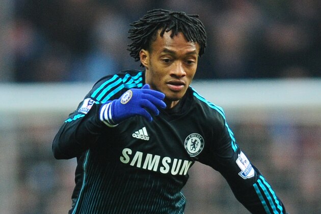 Chelsea's Juan Cuadrado controls the ball in his first game during the English Premier League soccer match between Aston Villa and Chelsea at Villa Park, Birmingham, England, Saturday, Feb 7, 2015. (AP Photo/Rui Vieira)