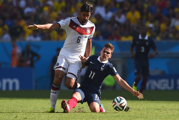 RIO DE JANEIRO, BRAZIL - JULY 04:  Antoine Griezmann of France tackles Sami Khedira of Germany  during the 2014 FIFA World Cup Brazil Quarter Final match between France and Germany at Maracana on July 4, 2014 in Rio de Janeiro, Brazil.  (Photo by Matthias Hangst/Getty Images)