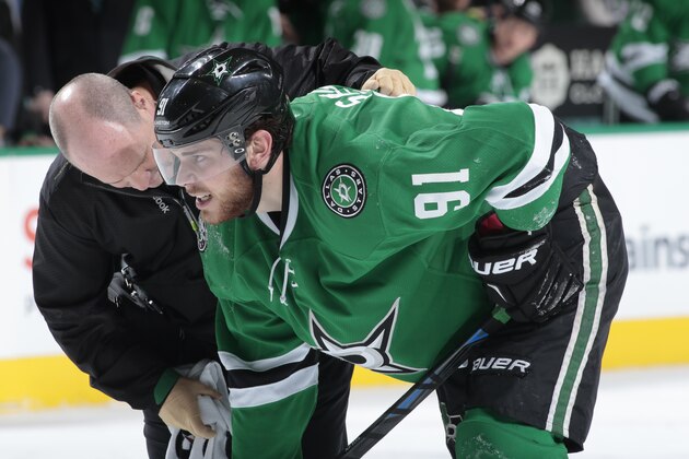 DALLAS, TX - FEBRUARY 13: Tyler Seguin #91 of the Dallas Stars takes a hit to the lower body and leaves the game against the Florida Panthers at the American Airlines Center on February 13, 2015 in Dallas, Texas. (Photo by Glenn James/NHLI via Getty Images)