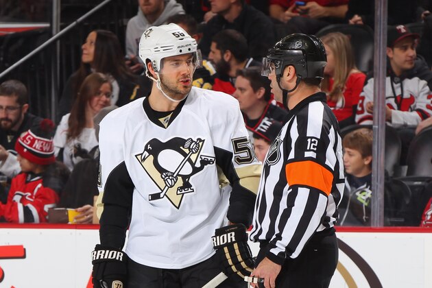 NEWARK, NJ - JANUARY 30: Referee Justin St. Pierre and Kris Letang #58 of the Pittsburgh Penguins talk during a timeout against the New Jersey Devils during the game at the Prudential Center on January 30, 2015 in Newark, New Jersey. (Photo by Andy Marlin/NHLI via Getty Images)