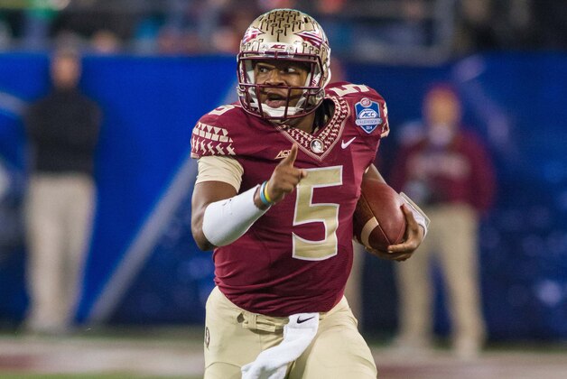 Dec 6, 2014; Charlotte, NC, USA; Florida State Seminoles quarterback Jameis Winston (5) runs the ball during the second quarter against the Georgia Tech Yellow Jackets at Bank of America Stadium. Mandatory Credit: Jeremy Brevard-USA TODAY Sports
