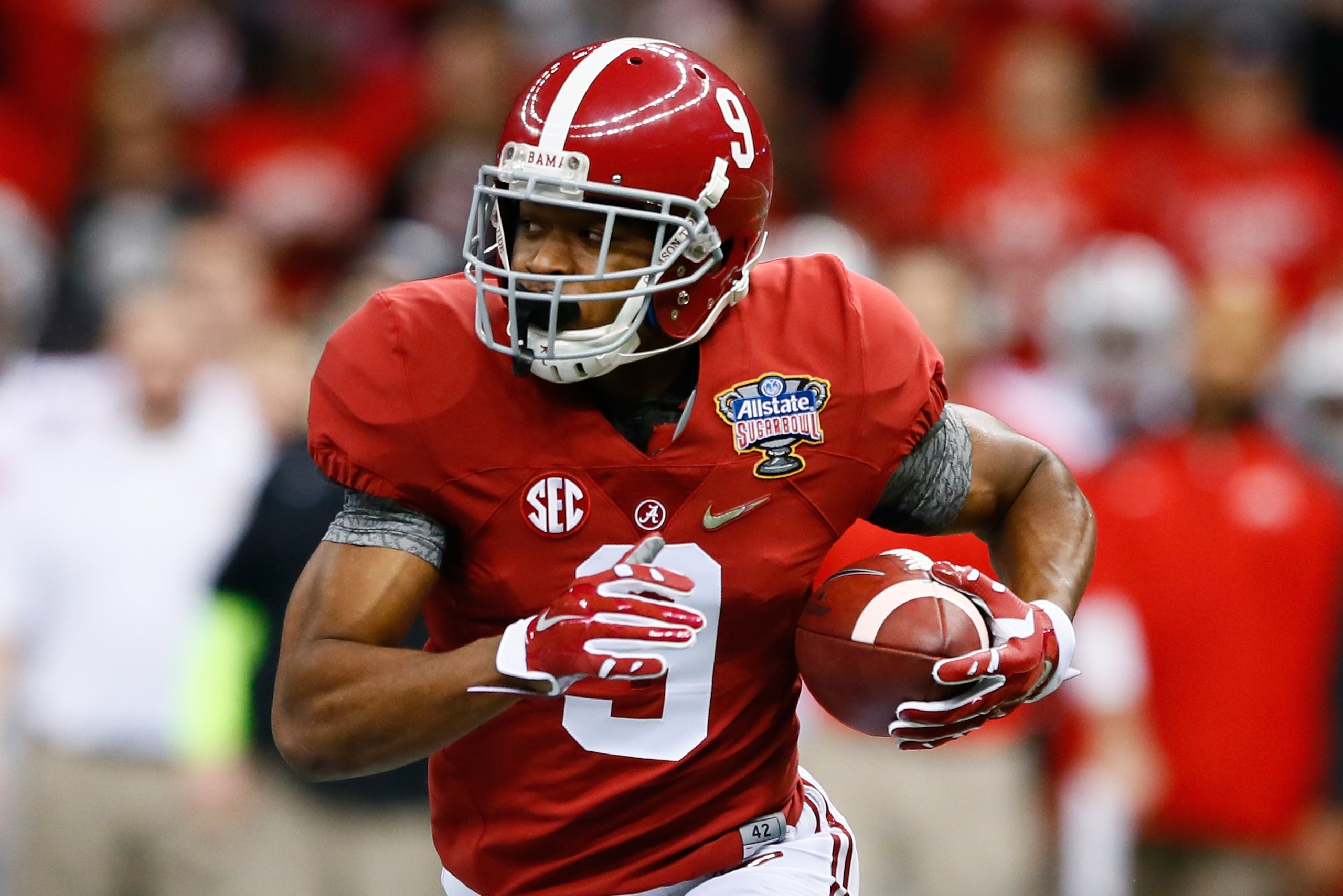 NEW ORLEANS, LA - JANUARY 01:  Amari Cooper #9 of the Alabama Crimson Tide runs the ball in the first quarter against the Ohio State Buckeyes during the All State Sugar Bowl at the Mercedes-Benz Superdome on January 1, 2015 in New Orleans, Louisiana.  (Photo by Kevin C. Cox/Getty Images)