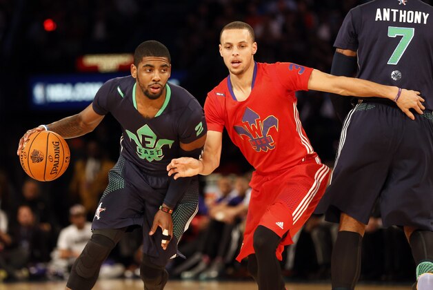 Feb 16, 2014; New Orleans, LA, USA; Eastern Conference Kyrie Irving guard (2) of the Cleveland Cavaliers dribbles around Western Conference guard Stephen Curry (30) of the Golden State Warriors during the 2014 NBA All-Star Game at the Smoothie King Center. Mandatory Credit: Derick E. Hingle-USA TODAY Sports