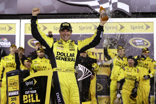 Matt Kenseth celebrates in Victory Lane with his crew after winning the NASCAR Sprint Unlimited auto race at Daytona International Speedway, Saturday, Feb. 14, 2015, in Daytona Beach, Fla. (AP Photo/John Raoux)