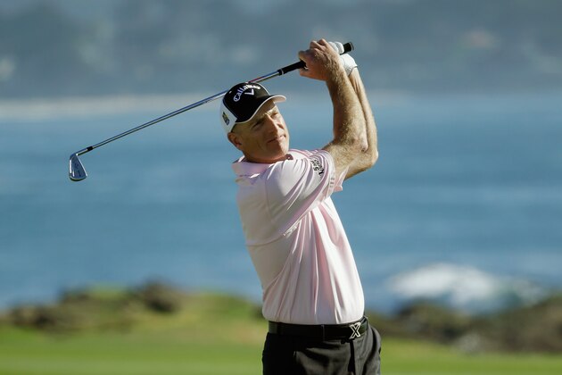 PEBBLE BEACH, CA - FEBRUARY 14:  Jim Furyk watches his second shot on the 18th hole during the third round of the AT