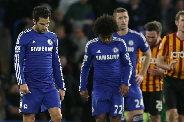 Chelsea’s Cesc Fabregas, center left, and Chelsea’s Willian, center right, look dejected during the English FA Cup 4th round soccer match between Bradford City and Chelsea at Stamford Bridge, London, England, Saturday, Jan. 24, 2015. (AP Photo/Tim Ireland)