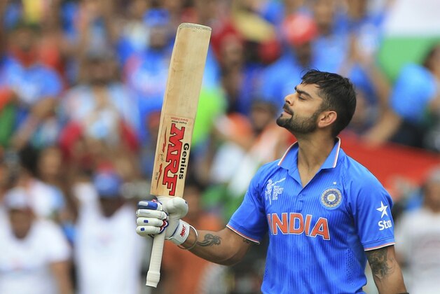 India’s Virat Kohli, celebrates his hundred runs during the World Cup Pool B match against Pakistan in Adelaide, Australia, Sunday, Feb. 15, 2015. (AP Photo/James Elsby)