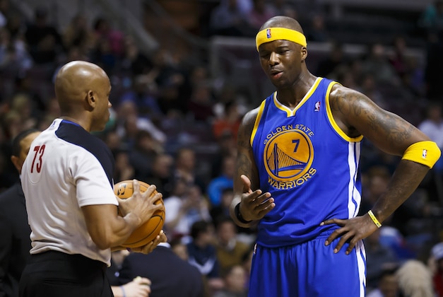 Feb 24, 2014; Auburn Hills, MI, USA; Golden State Warriors center Jermaine O'Neal (7) talks to referee Tre Maddox in the third quarter against the Detroit Pistons at The Palace of Auburn Hills. Golden State won 104-96. Mandatory Credit: Rick Osentoski-USA TODAY Sports