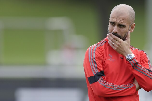 Bayern's head coach Pep Guardiola watches his team during a training session prior to the Champions League Group E soccer match against AS Roma in Munich, southern Germany, Monday Oct. 20, 2014. Bayern Munich  will face Rome on Tuesday. (AP Photo/Matthias Schrader)