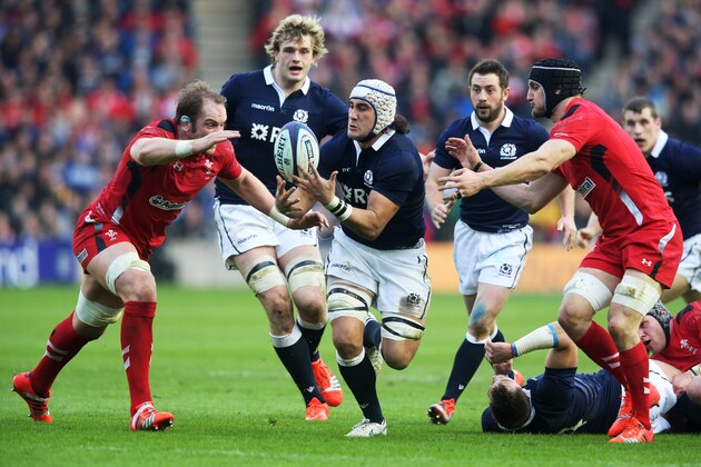EDINBURGH, SCOTLAND - FEBRUARY 15:  Blair Cowan of Scotland receives the ball as Alun Wyn Jones of Wales and Sam Warburton of Wales close in during the RBS Six Nations match between Scotland and Wales at Murrayfield Stadium on February 15, 2015 in Edinburgh, Scotland.  (Photo by David Rogers/Getty Images)