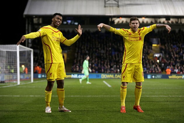 Liverpool's Daniel Sturridge, left, celebrates scoring his side's first goal with Alberto Moreno during the English FA Cup fifth round soccer match between Crystal Palace and Liverpool at Selhurst Park stadium in London, Saturday, Feb. 14, 2015.  (AP Photo/Matt Dunham)
