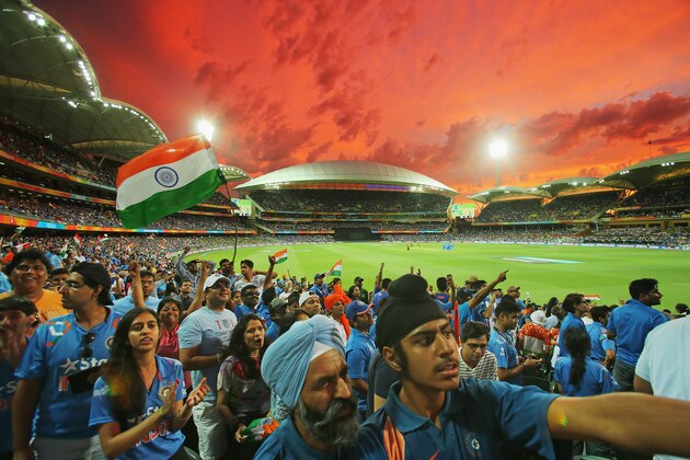 ADELAIDE, AUSTRALIA - FEBRUARY 15:  Indian fans in the crowd wait for a DRS decision to display on the large screen as they watch the match during the 2015 ICC Cricket World Cup match between India and Pakistan at Adelaide Oval on February 15, 2015 in Adelaide, Australia.  (Photo by Scott Barbour/Getty Images)