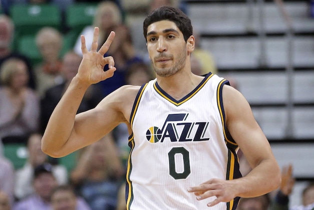 Utah Jazz's Enes Kanter (0) celebrates a 3-pointer in the first quarter during an NBA preseason basketball game against the Portland Trail Blazers Tuesday, Oct. 7, 2014, in Salt Lake City. (AP Photo/Rick Bowmer)