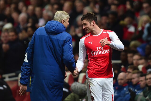 LONDON, ENGLAND - FEBRUARY 15: Arsene Wenger, manager of Arsenal shakes hands with Olivier Giroud of Arsenal during the FA Cup fifth round match between Arsenal and Middlesbrough at Emirates Stadium on February 15, 2015 in London, England.  (Photo by Jamie McDonald/Getty Images)