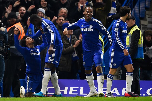 LONDON, ENGLAND - FEBRUARY 11:  Willian of Chelsea (L) celebrates scoring the first goal with Kurt Zouma of Chelsea  during the Barclays Premier League match between Chelsea and Everton at Stamford Bridge on February 11, 2015 in London, England.  (Photo by Mike Hewitt/Getty Images)