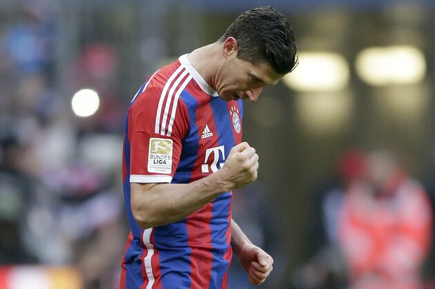Bayern's Robert Lewandowski from Poland celebrates after scoring his side's sixth goal during the German first division Bundesliga soccer match between FC Bayern Munich and Hamburger SV in the Allianz Arena in Munich, Germany, Saturday, Feb. 14, 2015. (AP Photo/Matthias Schrader)