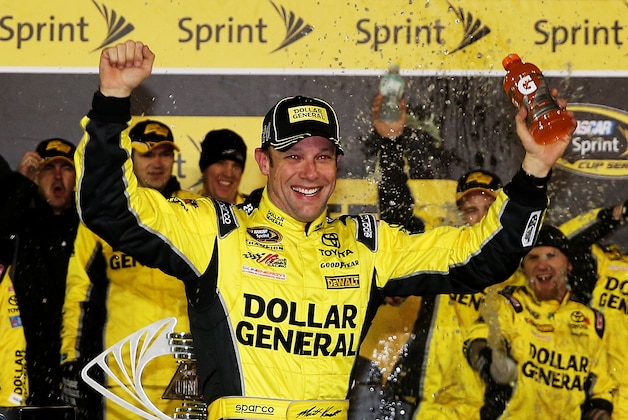 DAYTONA BEACH, FL - FEBRUARY 14:  Matt Kenseth, driver of the #20 Dollar General Toyota, celebrates in victory lane after winning the 3rd Annual Sprint Unlimited at Daytona at Daytona International Speedway on February 14, 2015 in Daytona Beach, Florida.  (Photo by Chris Graythen/Getty Images)