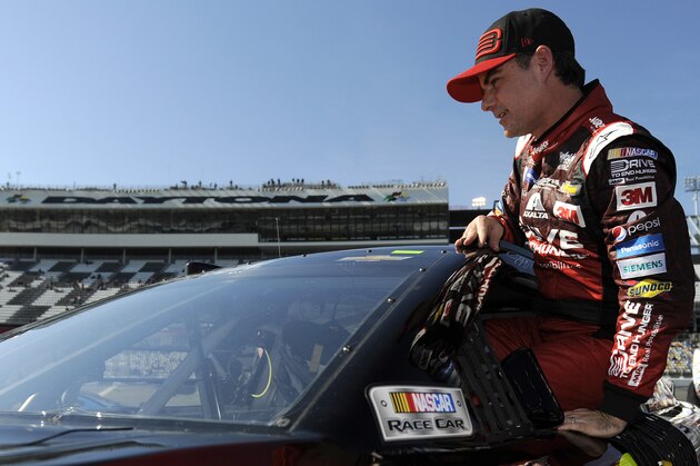 DAYTONA BEACH, FL - FEBRUARY 15: Jeff Gordon, driver of the #24 Drive To End Hunger Chevrolet, climbs out of his car after qualifying for the 57th Annual Daytona 500 at Daytona International Speedway on February 15, 2015 in Daytona Beach, Florida.  (Photo by Jared C. Tilton/Getty Images)