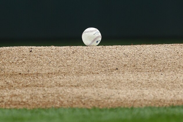 A baseball rests on the pitching mound before a baseball game between the Seattle Mariners and the Los Angeles Angels, Sunday, Sept. 28, 2014, in Seattle. (AP Photo/Ted S. Warren)