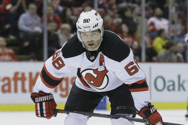 New Jersey Devils right wing Jaromir Jagr waits on the face-off during the first period of an NHL hockey game against the Detroit Red Wings in Detroit, Wednesday, Dec. 31, 2014. (AP Photo/Carlos Osorio)