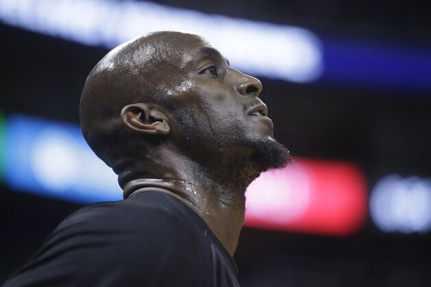 Brooklyn Nets forward Kevin Garnett looks on before the start of their NBA basketball game against the Utah Jazz Saturday, Jan. 24, 2015, in Salt Lake City. (AP Photo/Rick Bowmer)
