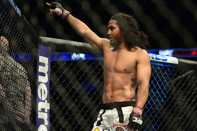 Feb 14, 2015; Broomfield, CO, USA; Benson Henderson (red) celebrates his win over Brandon Thatch (not pictured) following the welterweight bout at the UFC Fight Night at the 1stBANK Center. Mandatory Credit: Ron Chenoy-USA TODAY Sports