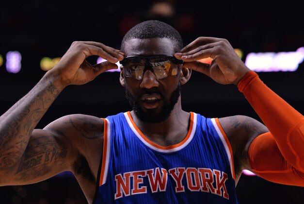 Feb 9, 2015; Miami, FL, USA; New York Knicks center Amar'e Stoudemire (1) adjusts his glasses before returning to the game during the second half against he Miami Heat at American Airlines Arena. Miami won 109-95. Mandatory Credit: Steve Mitchell-USA TODAY Sports