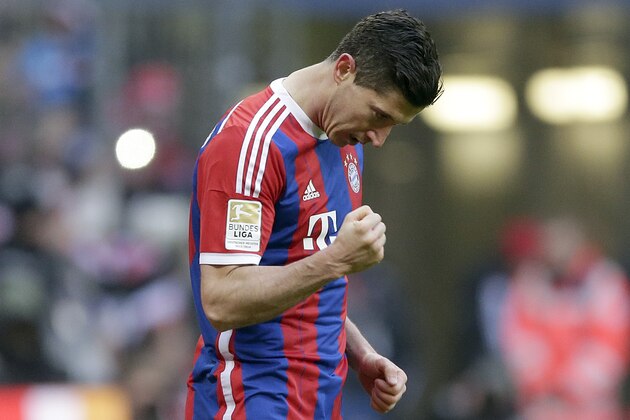 Bayern's Robert Lewandowski from Poland celebrates after scoring his side's sixth goal during the German first division Bundesliga soccer match between FC Bayern Munich and Hamburger SV in the Allianz Arena in Munich, Germany, Saturday, Feb. 14, 2015. (AP Photo/Matthias Schrader)