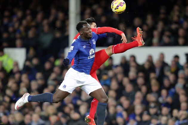 Everton's Romelu Lukaku, left, and Liverpool's Emre Can battle for the ball during their English Premier League soccer match at Goodison Park in Liverpool, England, Saturday Feb. 7, 2015. (AP Photo/Clint Hughes)