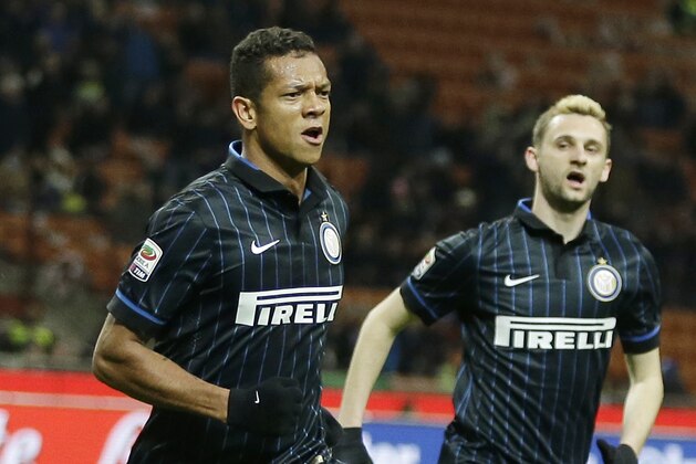 Inter Milan's Fredy Guarin, left, celebrates with his teammate Marcelo Brozovic  after scoring during the Serie A soccer match between Inter Milan and Palermo at the San Siro stadium in Milan, Italy, Sunday, Feb. 8, 2015. (AP Photo/Antonio Calanni)