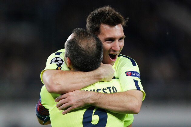 PARIS, FRANCE - SEPTEMBER 30:  Lionel Messi of Barcelona celebrates scoring his teams first goal of the game with Andres Iniesta during the Group F UEFA Champions League match between Paris Saint-Germain v FC Barcelona held at Parc des Princes on September 30, 2014 in Paris, France.  (Photo by Dean Mouhtaropoulos/Getty Images)