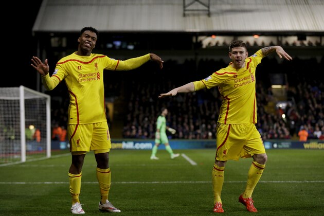 Liverpool's Daniel Sturridge, left, celebrates scoring his side's first goal with Alberto Moreno during the English FA Cup fifth round soccer match between Crystal Palace and Liverpool at Selhurst Park stadium in London, Saturday, Feb. 14, 2015.  (AP Photo/Matt Dunham)