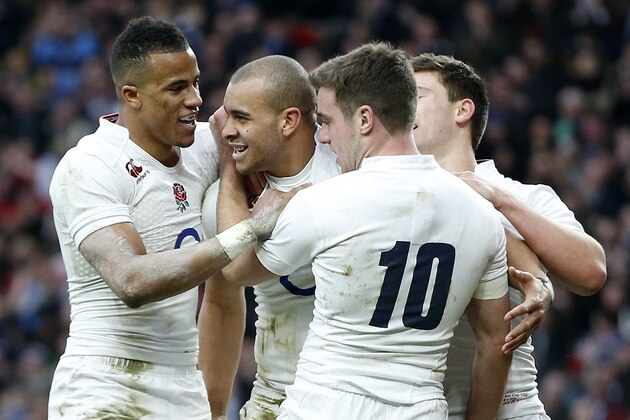 England’s Jonathan Joseph, second left celebrates with teammates after scoring a try during the Six Nations international rugby union match against Italy at Twickenham stadium in London, Saturday, Feb. 14, 2015. (AP Photo/Alastair Grant)