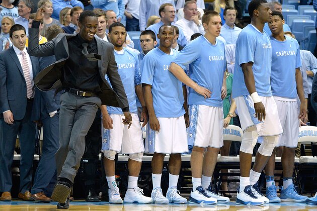 CHAPEL HILL, NC - FEBRUARY 02:  An injured Theo Pinson #1 of the North Carolina Tar Heels, in a walking cast, dances before the start of a game against the Virginia Cavaliers at the Dean Smith Center on February 2, 2015 in Chapel Hill, North Carolina.  (Photo by Grant Halverson/Getty Images)