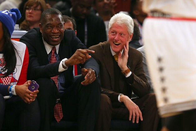 NEW YORK, NY - FEBRUARY 15:  NBA Legend Dikembe Mutombo talks with former president Bill Clinton during the 2015 NBA All-Star Game at Madison Square Garden on February 15, 2015 in New York City.  NOTE TO USER: User expressly acknowledges and agrees that, by downloading and/or using this photograph, user is consenting to the terms and conditions of the Getty Images License Agreement.  (Photo by Elsa/Getty Images)
