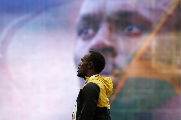 Jamaica's Usain Bolt listens to the national anthem during the medal ceremony for the men's 200 meters at the World Athletics Championships in the Luzhniki stadium in Moscow, Russia, Sunday, Aug. 18, 2013. (AP Photo/Alexander Zemlianichenko)