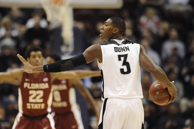 Providence’s Kris Dunn gestures to a teammate during the first half of an NCAA college basketball game, Saturday, Nov. 22, 2014, in Uncasville, Conn.  (AP Photo/Jessica Hill)