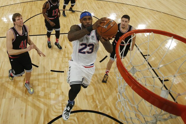 East Team’s LeBron James, of the Cleveland Cavaliers, goes up for a shot during the first half of the NBA All-Star basketball game, Sunday, Feb. 15, 2015, in New York. The West Team won 163-158. (AP Photo/Kathy Willens, Pool)