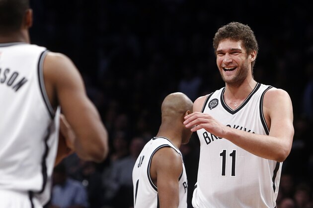Brooklyn Nets' Brook Lopez (11) reacts during the fourth quarter of an NBA basketball game against the Toronto Raptors Friday, Jan. 30, 2015, in New York.  Toronto defeated Brooklyn 127-122 in overtime. (AP Photo/Jason DeCrow)