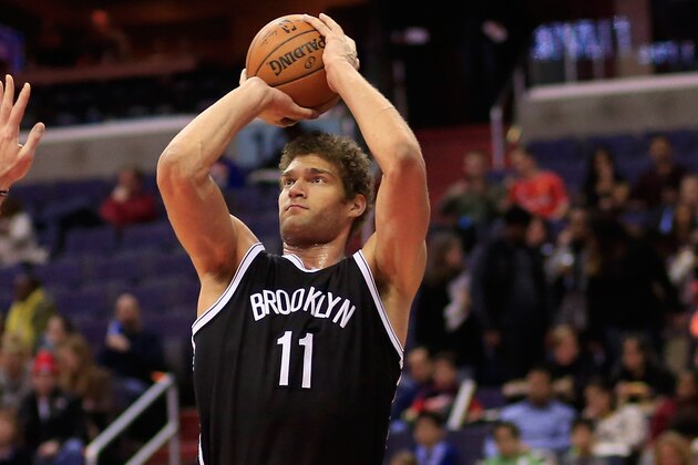 WASHINGTON, DC - FEBRUARY 07: Brook Lopez #11 of the Brooklyn Nets puts up a shot in front of Marcin Gortat #4 of the Washington Wizards during the first half at Verizon Center on February 7, 2015 in Washington, DC. NOTE TO USER: User expressly acknowledges and agrees that, by downloading and or using this photograph, User is consenting to the terms and conditions of the Getty Images License Agreement.  (Photo by Rob Carr/Getty Images)