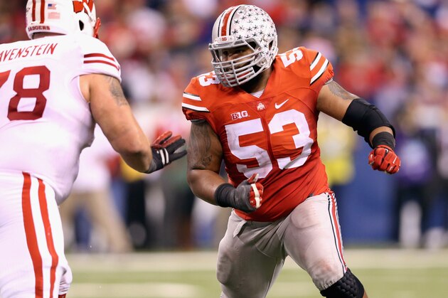 INDIANAPOLIS, IN - DECEMBER 06:  Defensive lineman Michael Bennett wears #53 to honor late teammate Kosta Karageorge of the Ohio State Buckeyes while playing in the Big Ten Championship against the Wisconsin Badgers at Lucas Oil Stadium on December 6, 2014 in Indianapolis, Indiana.  (Photo by Andy Lyons/Getty Images)