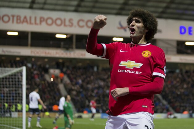 Manchester United's Marouane Fellaini celebrates after scoring during the English FA Cup Fifth Round soccer match between Preston and Manchester United at Deepdale Stadium in Preston, England, Monday Feb. 16, 2015.  (AP Photo/Jon Super)