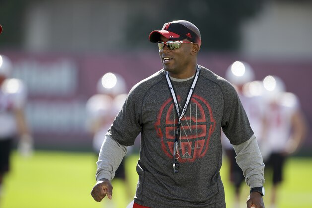 Nebraska secondary coach Charlton Warren smiles during team practice in Lincoln, Neb., Wednesday, Aug. 13, 2014. (AP Photo/Nati Harnik)