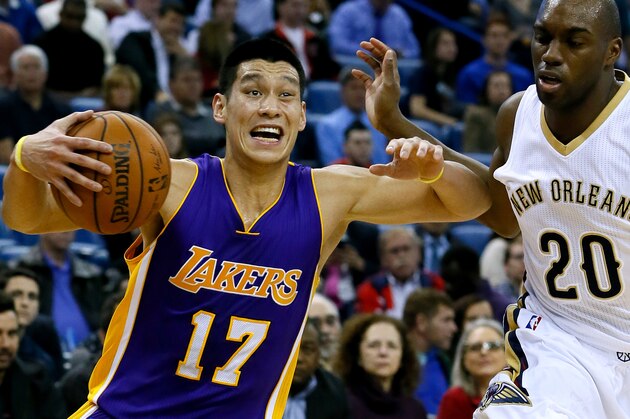 Los Angeles Lakers guard Jeremy Lin (17) drives against New Orleans Pelicans guard Quincy Pondexter (20) during the first half of an NBA basketball game, Wednesday, Jan. 21, 2015, in New Orleans. (AP Photo/Jonathan Bachman)