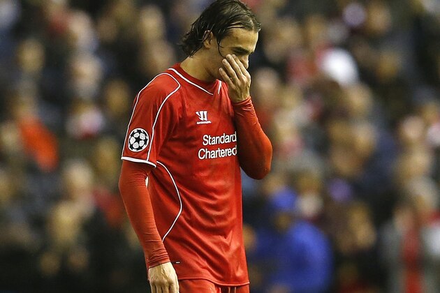Liverpool's Lazar Markovic leaves the field after being shown the red card during the Champions League Group B soccer match between Liverpool and FC Basel at Anfield Stadium in Liverpool, England, Tuesday, Dec. 9, 2014. (AP Photo/Jon Super)